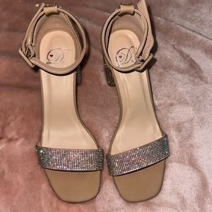 Nude high heels with silver gems on the heel and band. Size 6.5 Never Used!!!
